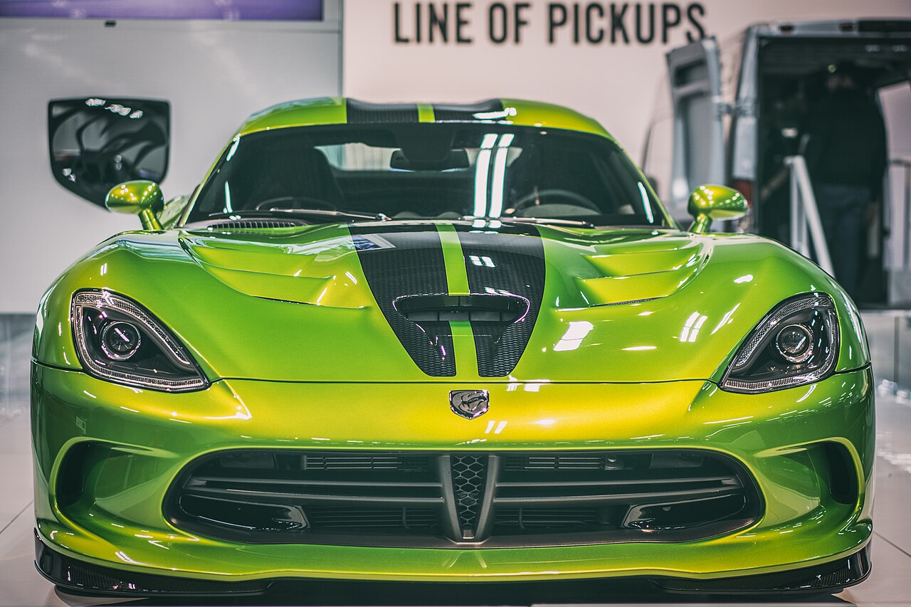 Lime green Dodge Viper with black stripes over the bonnet and roof, head-on view at the Edmonton Motor Show.